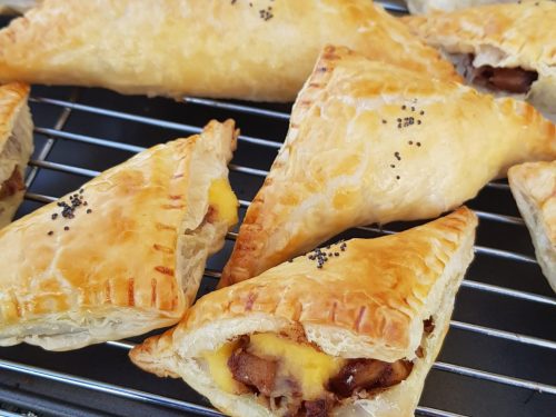 Puff pastry triangles with cinnamon apple walnut custard filling